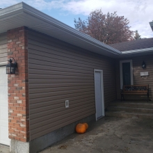 Completed roofing, soffit/fascia, eaves and siding.<br> Roof installed with BP Mystique architectural shingles in Autumn brown. To update the exterior, we replaced all soffit/fascia, eaves, downspouts. Siding was replaced with Royal residential siding 